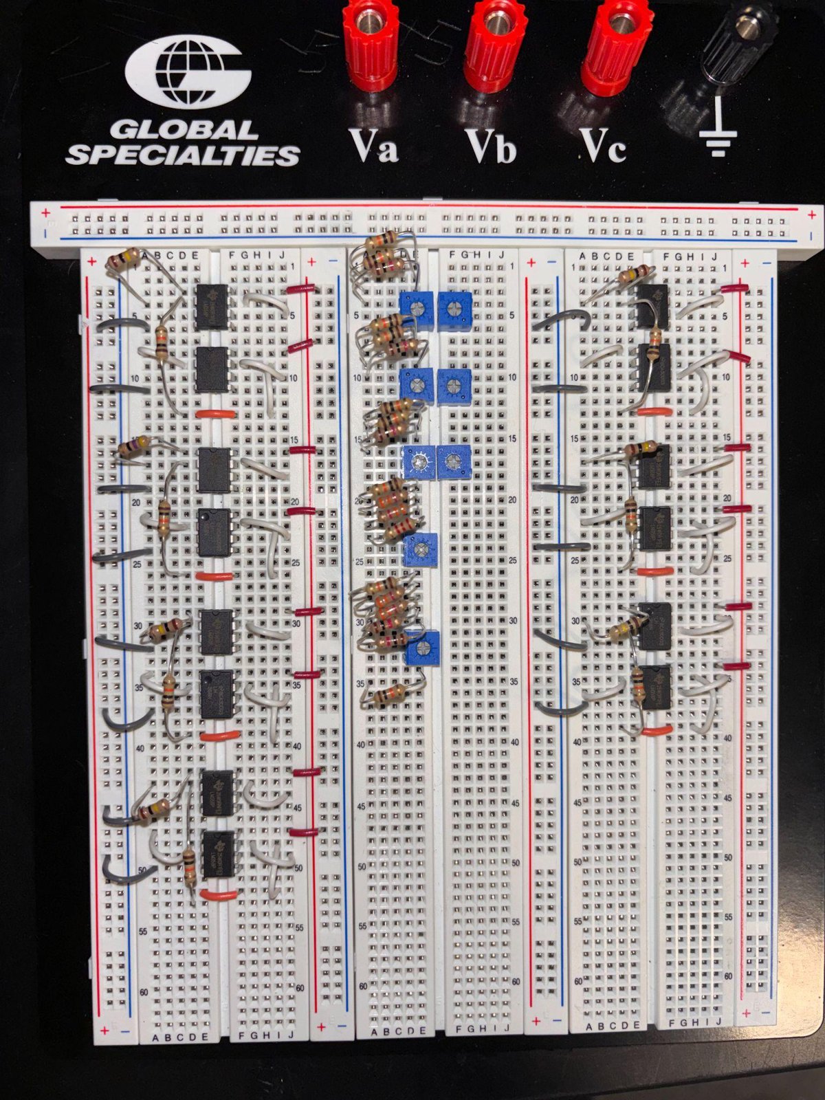 The completed pressure piano: three breadboards wired together on the bench, powered from a lab supply.