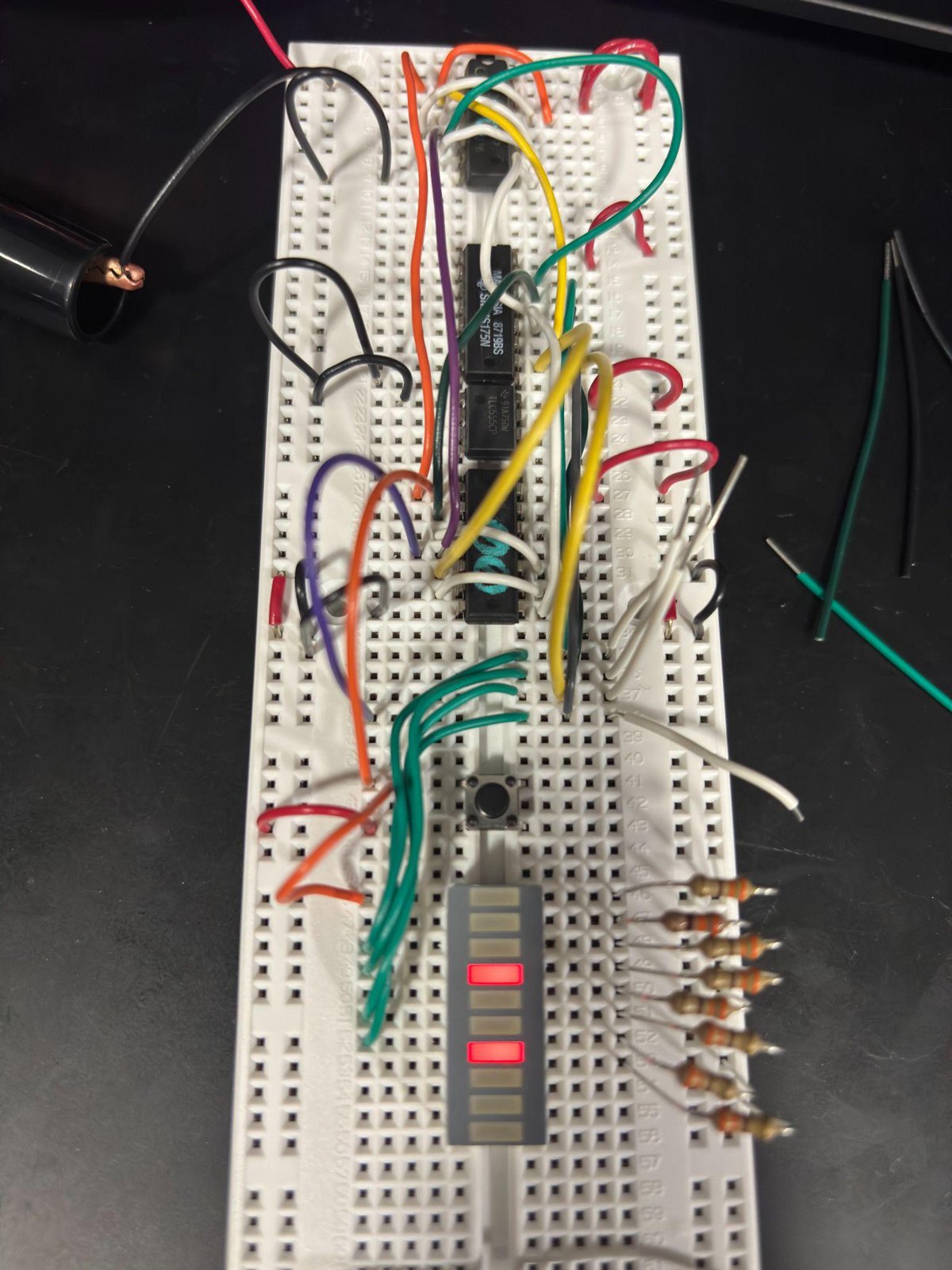 Close-up of a tone-generator board showing op-amp ICs and rows of resistors.